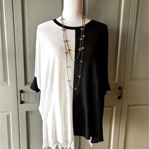 Size large tunic in lightweight black and white knit.